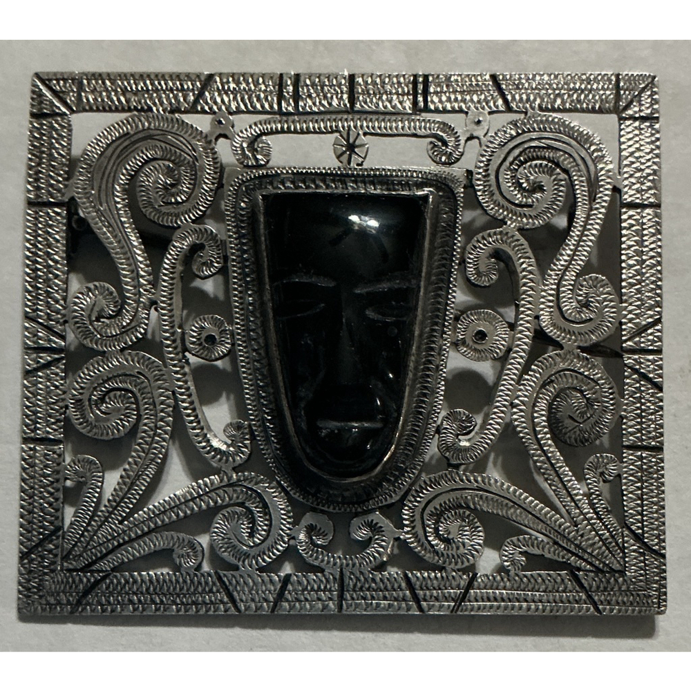 Vintage silver brooch with carved black onyx tribal mask